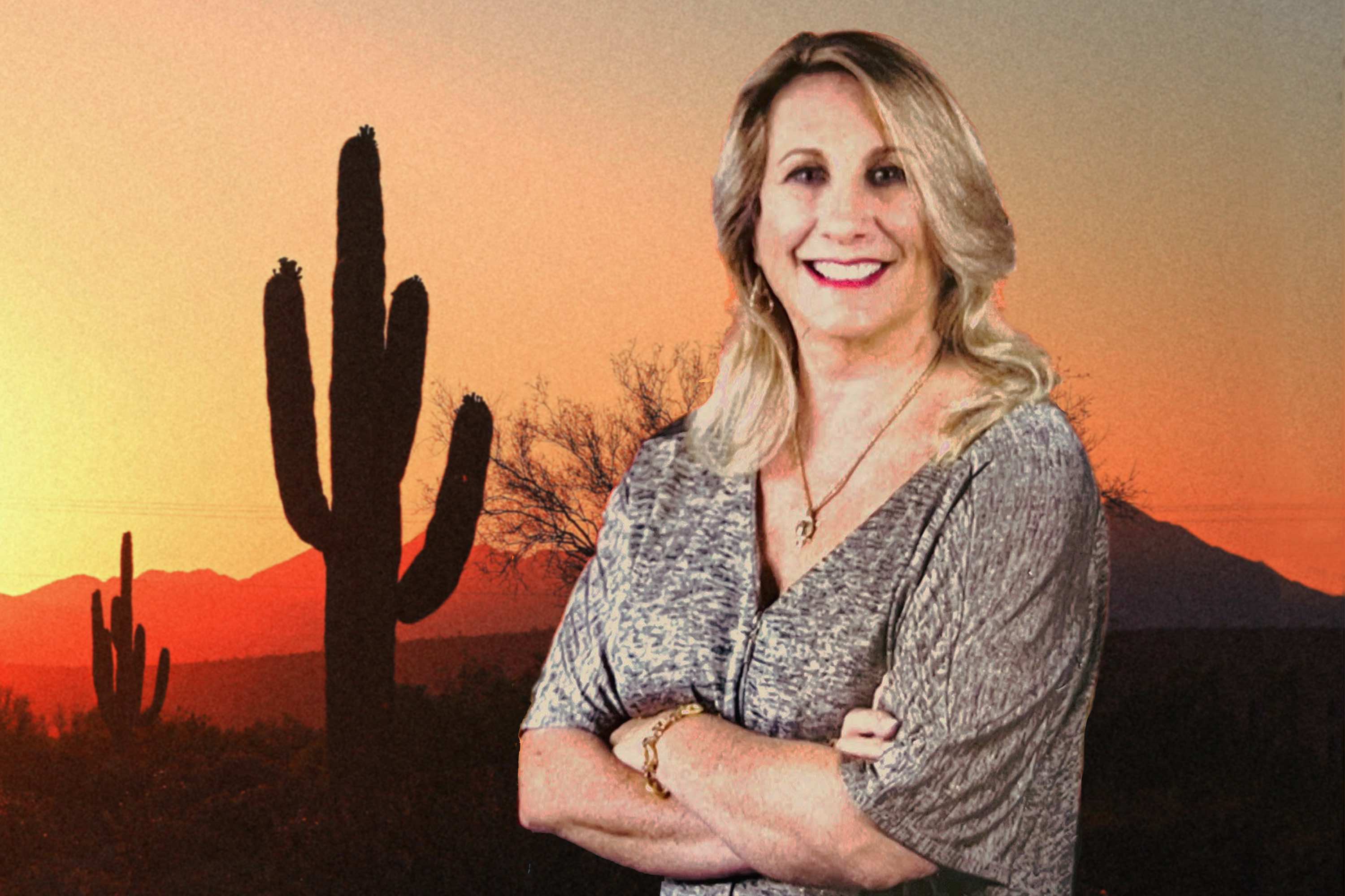 Cindie in front of an Arizona sunset.
